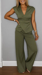 Women's pleated vest and pants set by FitiqueFit featuring metal buckle details, casualwear style, shown in a stylish outfit.