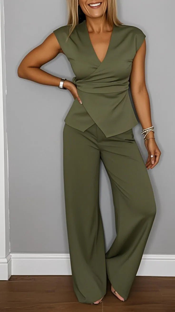 Women's pleated vest and pants set by FitiqueFit featuring metal buckle details, casualwear style, shown in a stylish outfit.
