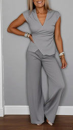 Women's pleated vest and pants set by FitiqueFit, featuring metal buckle details for a stylish casualwear look.