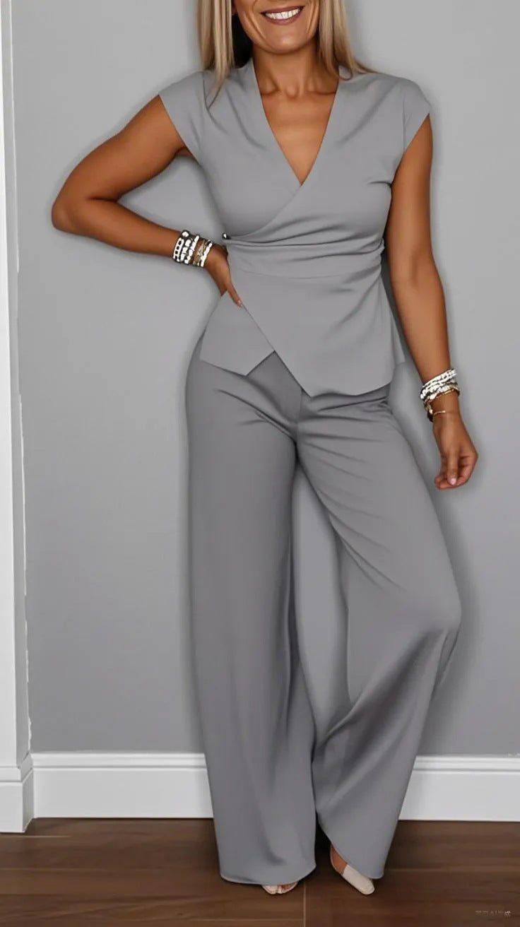 Women's pleated vest and pants set by FitiqueFit, featuring metal buckle details for a stylish casualwear look.