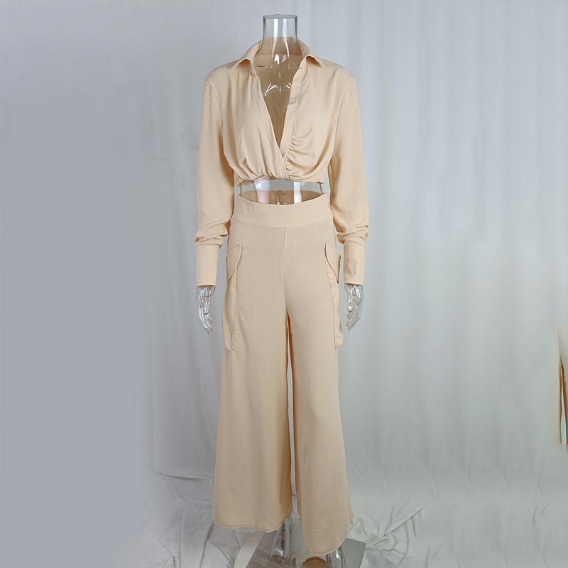 Plus size women's wide-leg elegant pant set by FitiqueFit, featuring a stylish casualwear ensemble with flowing wide-leg pants and a matching top.