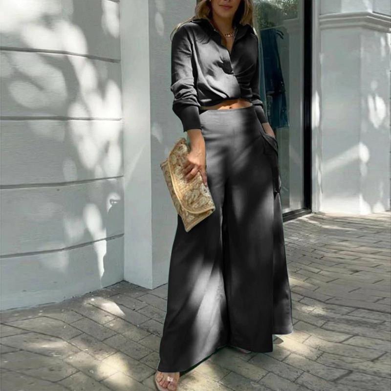 Plus size women's wide-leg elegant pant set by FitiqueFit, featuring a stylish casualwear look with flowing wide-leg pants and a matching top.