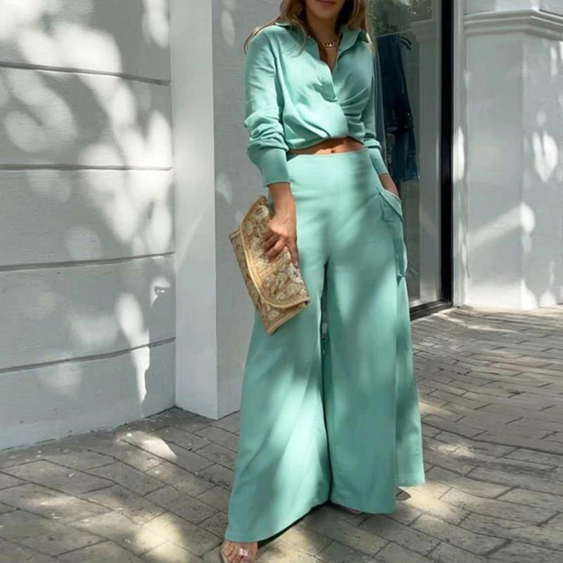 Plus size women's wide-leg elegant pant set by FitiqueFit, casualwear with flowing wide-leg trousers and a stylish top.
