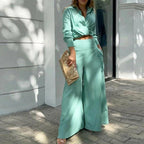 Plus size women's wide-leg elegant pant set by FitiqueFit, casualwear with flowing wide-leg trousers and a stylish top.