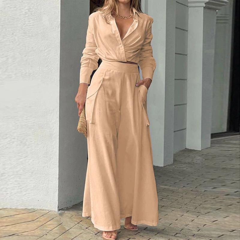 Plus size women's wide-leg pant set by FitiqueFit, featuring an elegant casualwear outfit with flowing wide-leg pants and stylish top.