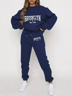 Women’s plush hoodie and pants sweater set by FitiqueFit, cozy winter tracksuit with soft fabric and comfortable fit.