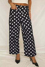 Women's polka dot straight leg pants with pockets by Trendsi, featuring a stylish fit and comfortable design.