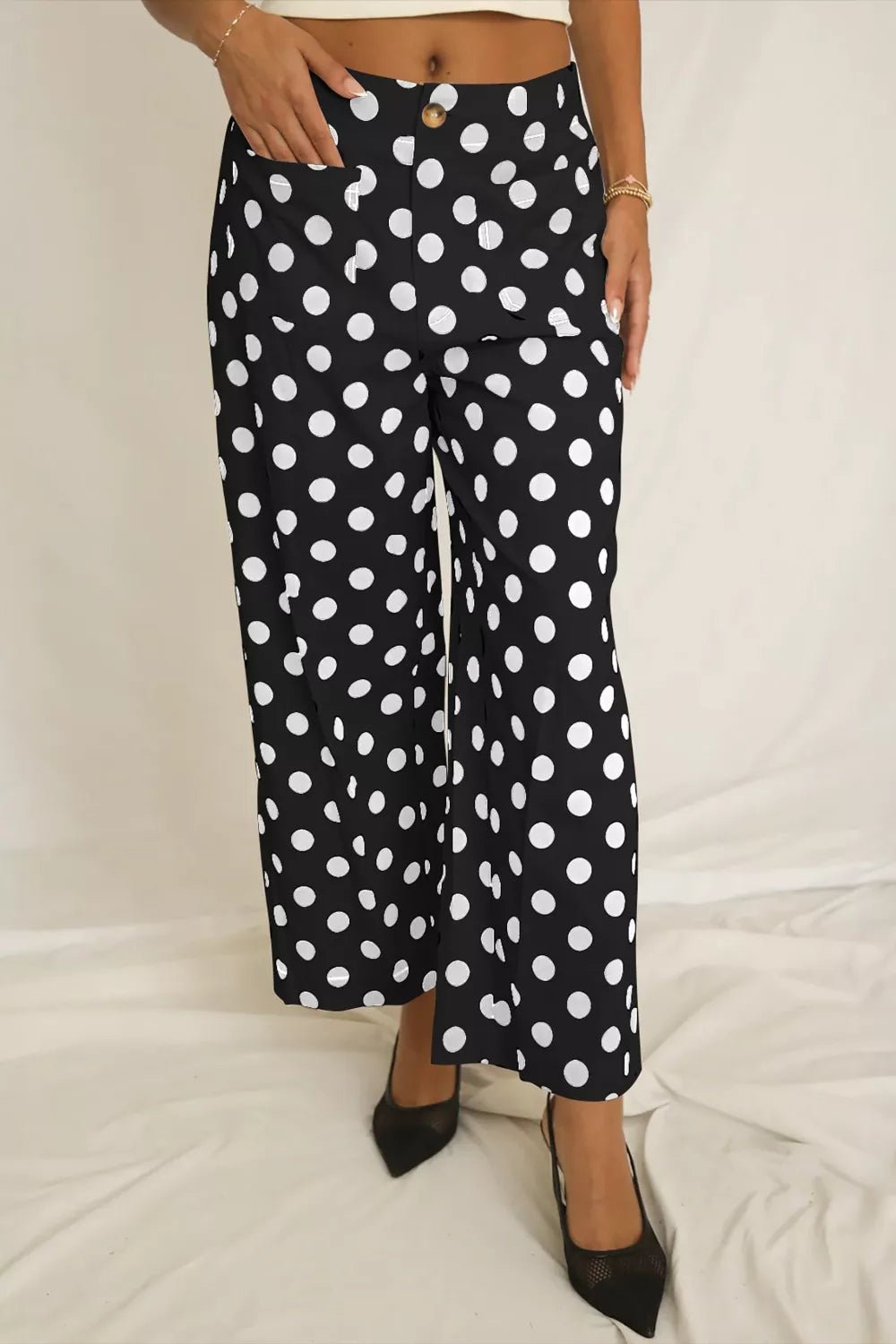 Women's polka dot straight leg pants with pockets by Trendsi, featuring a comfortable fit and classic pattern.