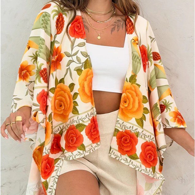 Women’s printed cardigan top with drop shoulder sleeves, casualwear by FitiqueFit, showcasing a colorful floral pattern and relaxed fit.