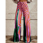 Women’s printed flare pants by FitiqueFit, mid-waist casualwear with full length and plus size fit, featuring colorful floral pattern.