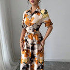 Women’s printed puff sleeve casual dress by FitiqueFit with blouse collar and cross-tie waist, perfect for everyday wear.