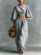 Women's puff-sleeve crew-neck two-piece casual set with pockets, made by Plush Fashion Hub, shown on a model.