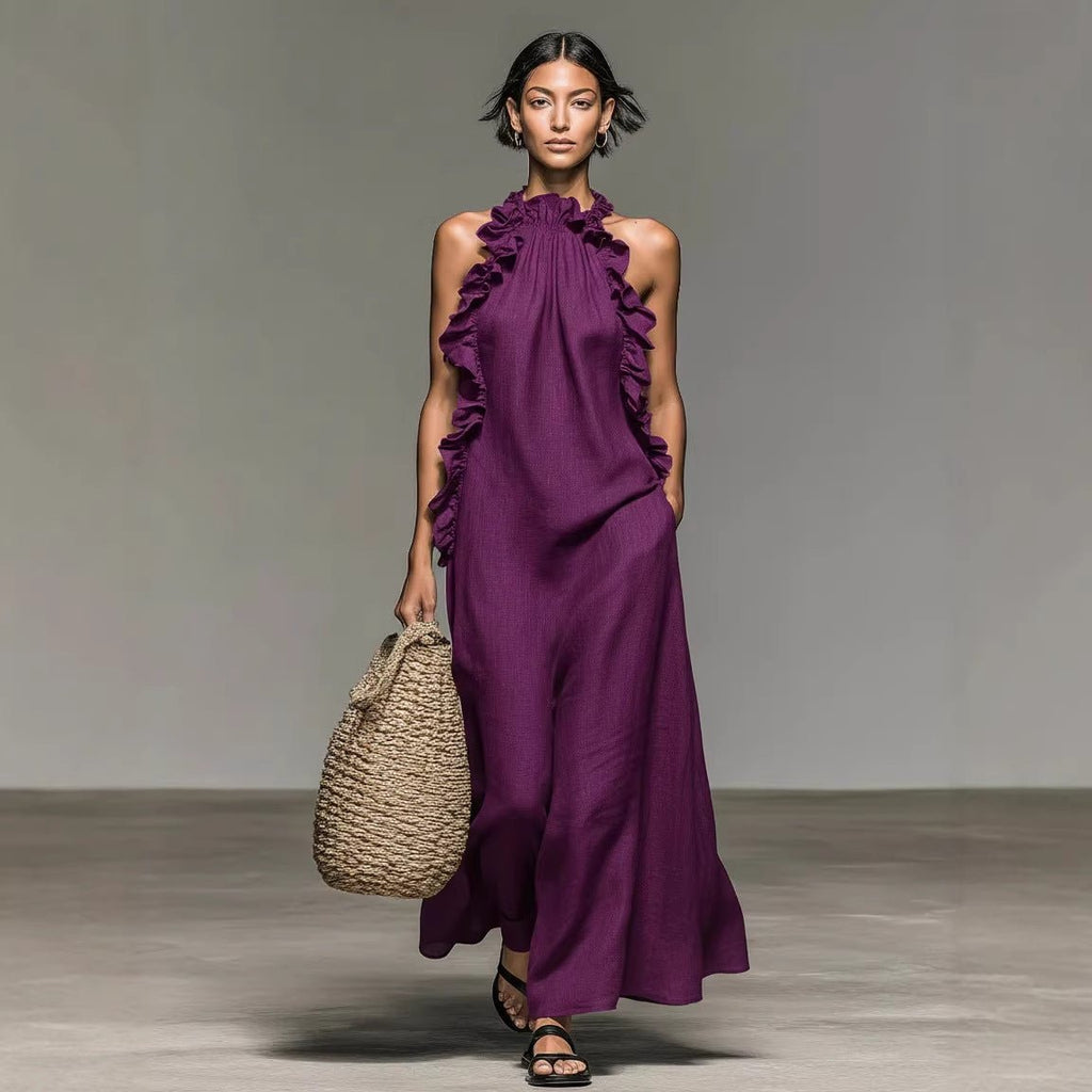 Women's ruffled halterneck sleeveless open-back maxi dress by FitiqueFit, perfect for resort casualwear, with flowing fabric and elegant design.