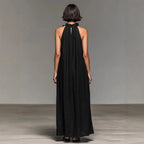 Women's FitiqueFit ruffled halterneck sleeveless open-back maxi dress, perfect for resort casualwear, with flowing fabric and elegant design.