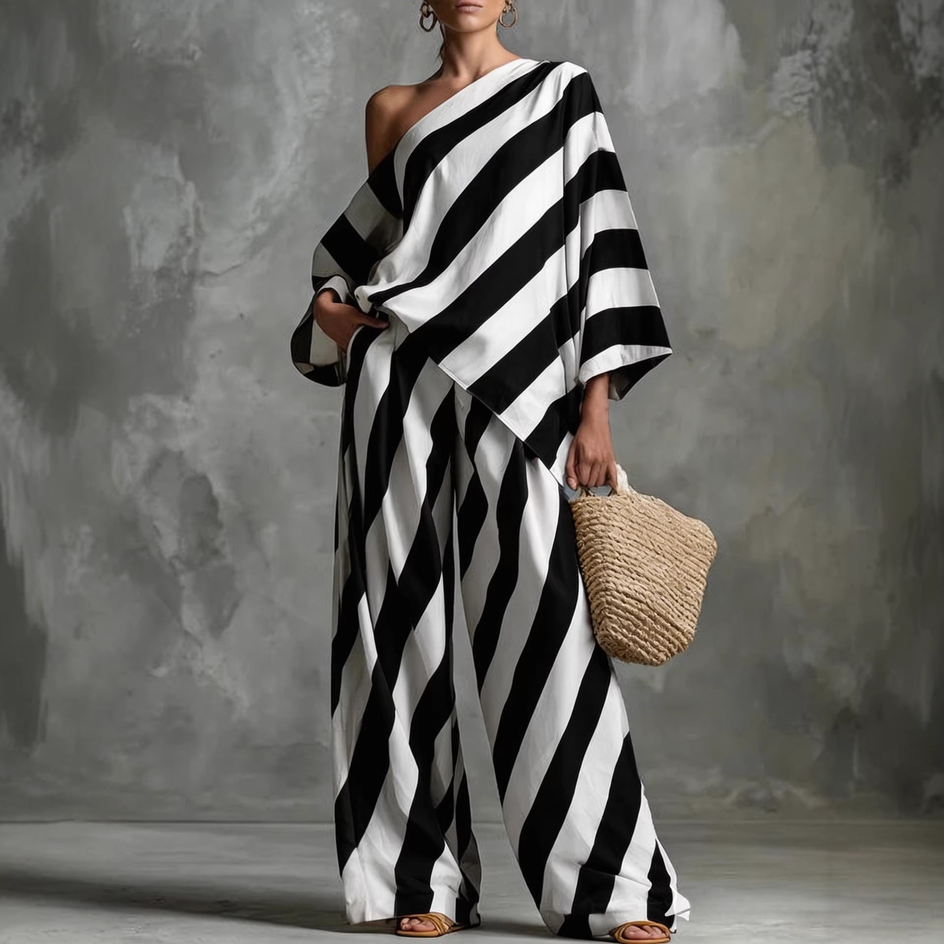 Women's retro striped batwing top and wide-leg pants set by FitiqueFit, casual vintage 2-piece ensemble with bold stripes.