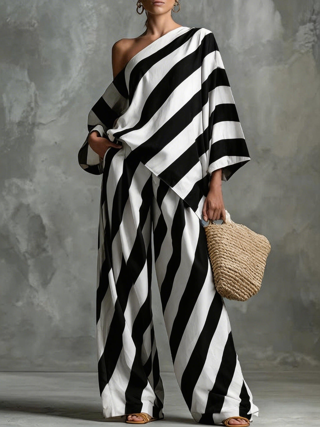 Women's retro striped batwing top and wide-leg pants set by FitiqueFit, vintage casualwear with bold horizontal stripes and relaxed fit.
