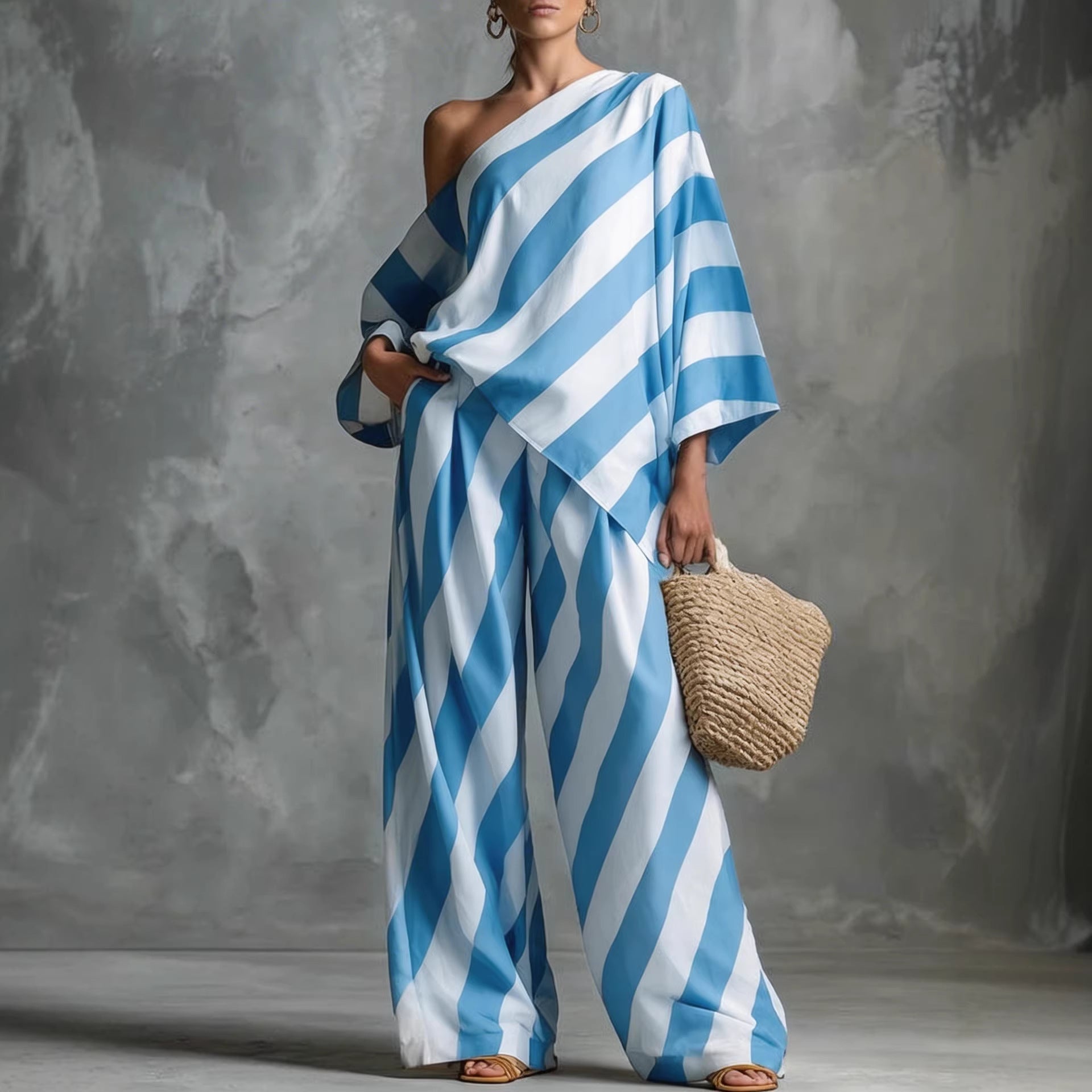 Women's retro striped batwing top and wide-leg pants set by FitiqueFit, showcasing vintage-inspired casualwear ensemble.