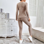 Women’s ribbed knit long-sleeve tee and pants lounge set by FitiqueFit, featuring comfortable casualwear in a soft fabric.