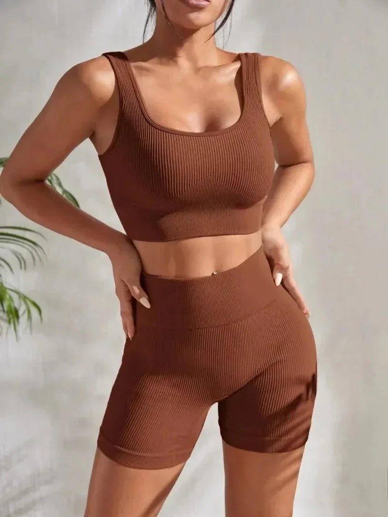 Women’s seamless ribbed yoga set by FitiqueFit, featuring a fitted tank top and high-waisted leggings in soft, stretchy fabric.