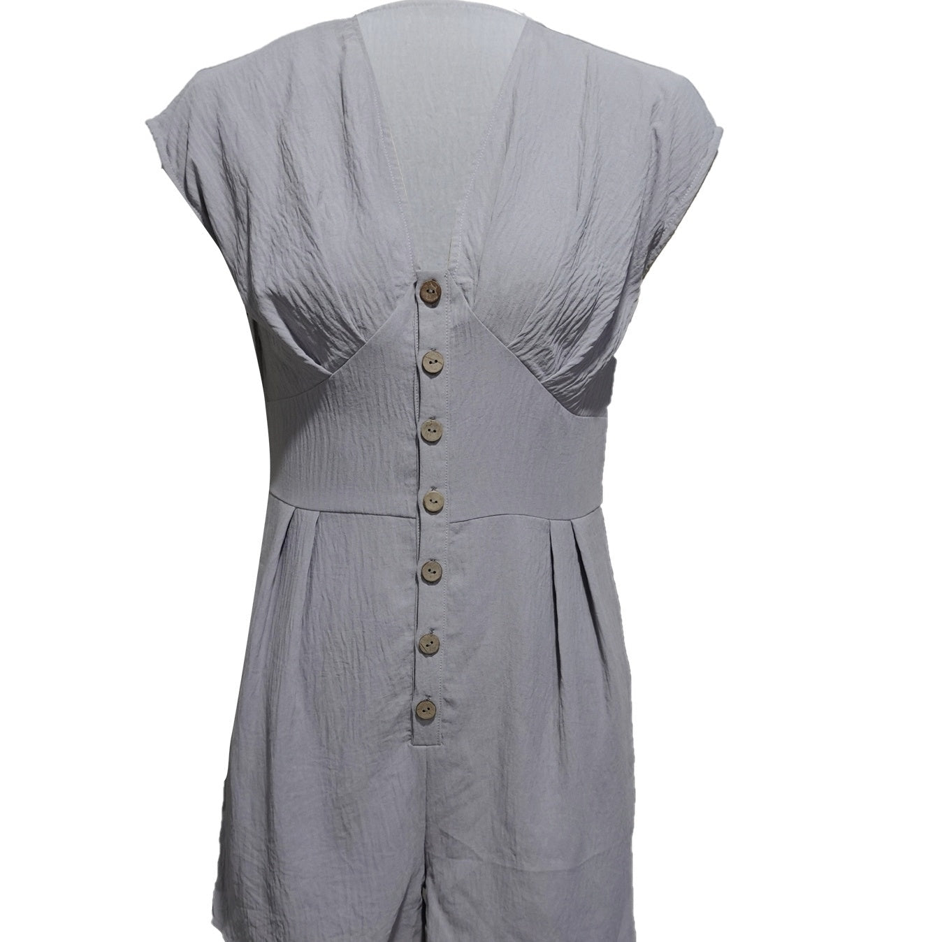 Women’s casual FitiqueFit short button-front jumpsuit with V-neck and patchwork design, perfect for stylish everyday wear.