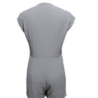 Women’s short button-front jumpsuit with V-neck and patchwork design, casualwear by FitiqueFit, shown on a model.
