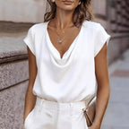Women's short-sleeve turtleneck top by FitiqueFit, loose fit casual pullover in soft fabric, shown on a model.