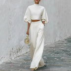 Women’s casual two-piece outfit with a short top and high-waisted pants by FitiqueFit, shown in a stylish, relaxed fit.