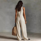 Women’s linen-blend sleeveless jumpsuit by FitiqueFit, casualwear with a relaxed fit and simple design, shown on a model.