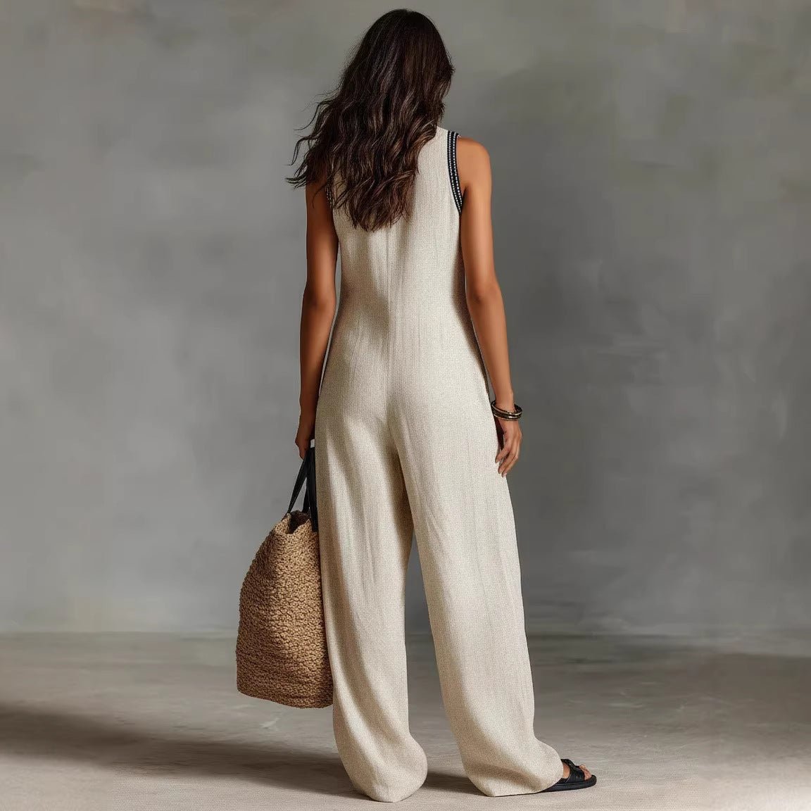 Women’s linen-blend sleeveless jumpsuit by FitiqueFit, casualwear with a relaxed fit and simple design, shown on a model.