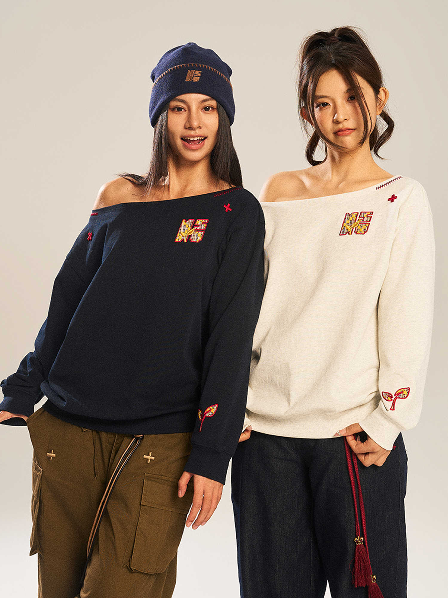 Women’s slanted shoulder embroidered long-sleeve top by FitiqueFit, featuring intricate embroidery and casual chic design.