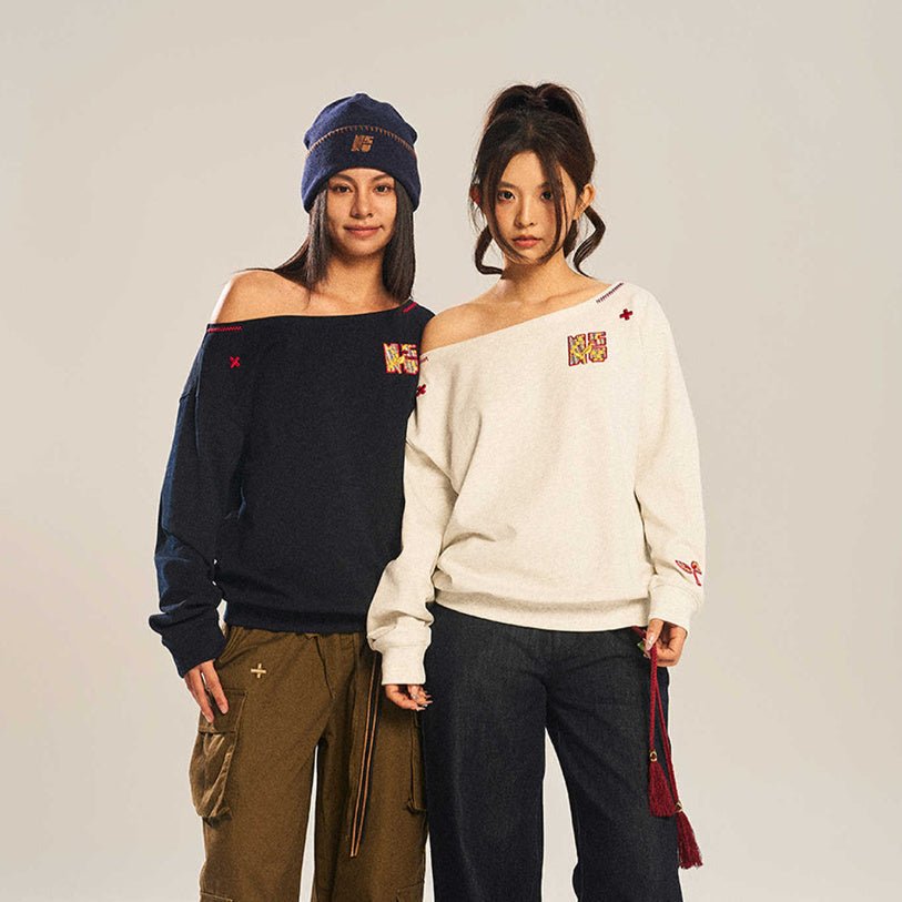Women’s slanted shoulder embroidered long-sleeve top by FitiqueFit, featuring intricate embroidery and a casual, stylish fit.