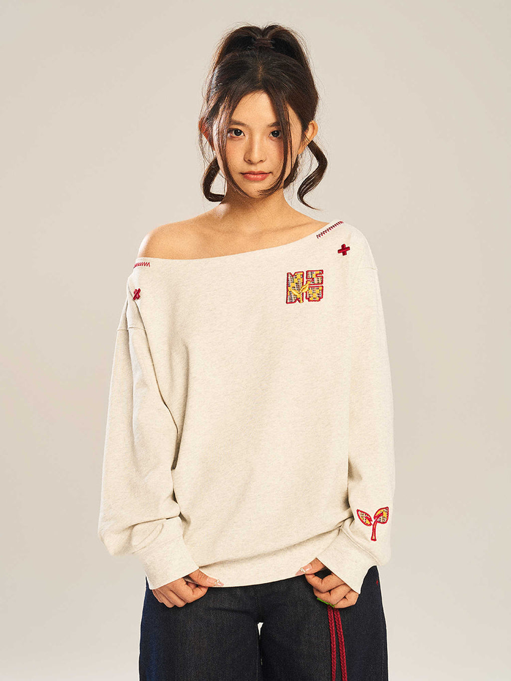 Women’s slanted shoulder embroidered long-sleeve casual top by FitiqueFit, featuring intricate embroidery and a stylish slanted shoulder design.