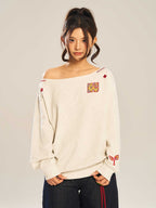 Women’s slanted shoulder embroidered long-sleeve casual top by FitiqueFit, featuring intricate embroidery and a stylish slanted shoulder design.