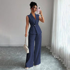 Women’s sleeveless blazer and straight-leg pants two-piece casualwear set by FitiqueFit, shown on a model with neutral background.