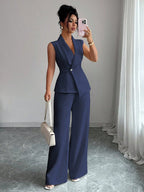 Women's sleeveless blazer and straight-leg pants two-piece casualwear set by FitiqueFit, shown on a model in a stylish, relaxed pose.
