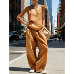 Women's sleeveless cardigan top and matching pants two-piece casualwear set by FitiqueFit, shown in a relaxed fit and neutral color.