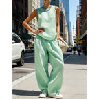 Women's sleeveless cardigan top and matching pants two-piece casualwear set by FitiqueFit, shown on a model.