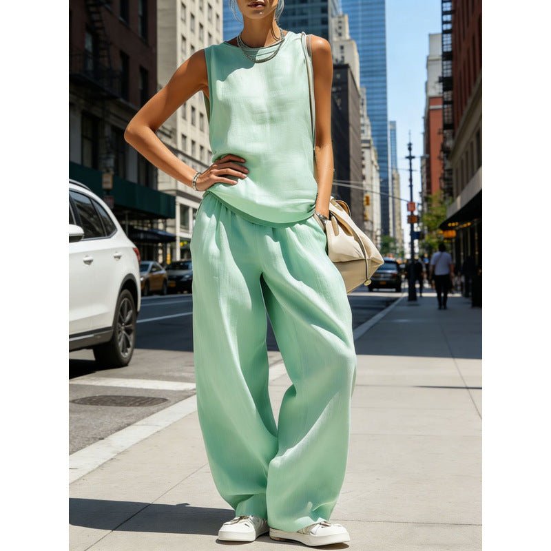 Women's sleeveless cardigan top and matching pants two-piece casualwear set by FitiqueFit, shown on a model.