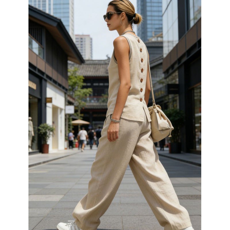 Women's sleeveless cardigan top and pants two-piece casualwear set by FitiqueFit, shown in a relaxed, stylish outfit.