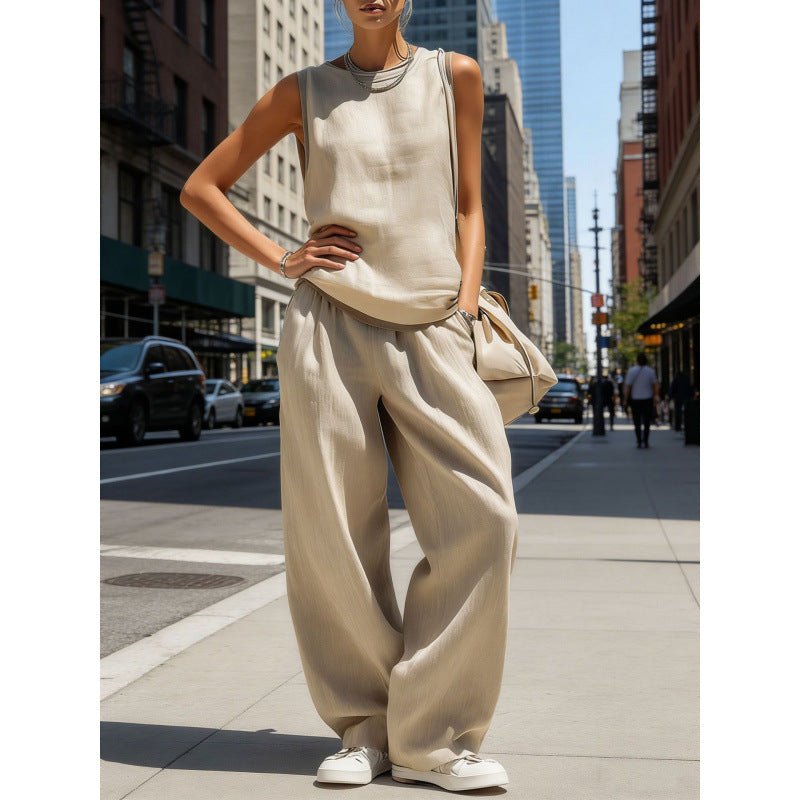 Women’s sleeveless cardigan top and matching pants two-piece casualwear set by FitiqueFit, shown on a model against a white background.