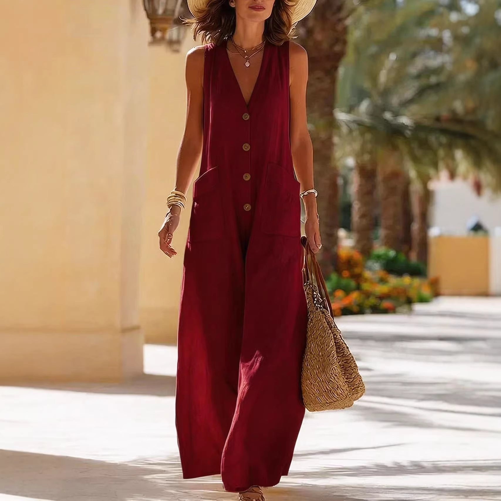 Women's sleeveless cotton linen wide-leg jumpsuit with button pockets, casualwear by FitiqueFit, shown on a model.
