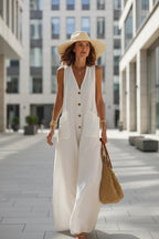 Women's sleeveless cotton linen wide-leg jumpsuit with button pockets, casualwear by FitiqueFit, displayed on a model.