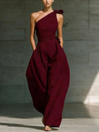 Women's sleeveless halter neck cinched waist slim jumpsuit in six colors by FitiqueFit, shown in size S to 2XL.