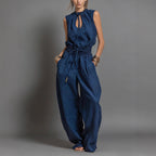 Women's sleeveless high-waist wide-leg pleated jumpsuit in casualwear style, by FitiqueFit, shown on a model.