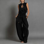 Women's sleeveless high-waist wide-leg pleated jumpsuit by FitiqueFit, featuring a casual, stylish design and flowing fabric.