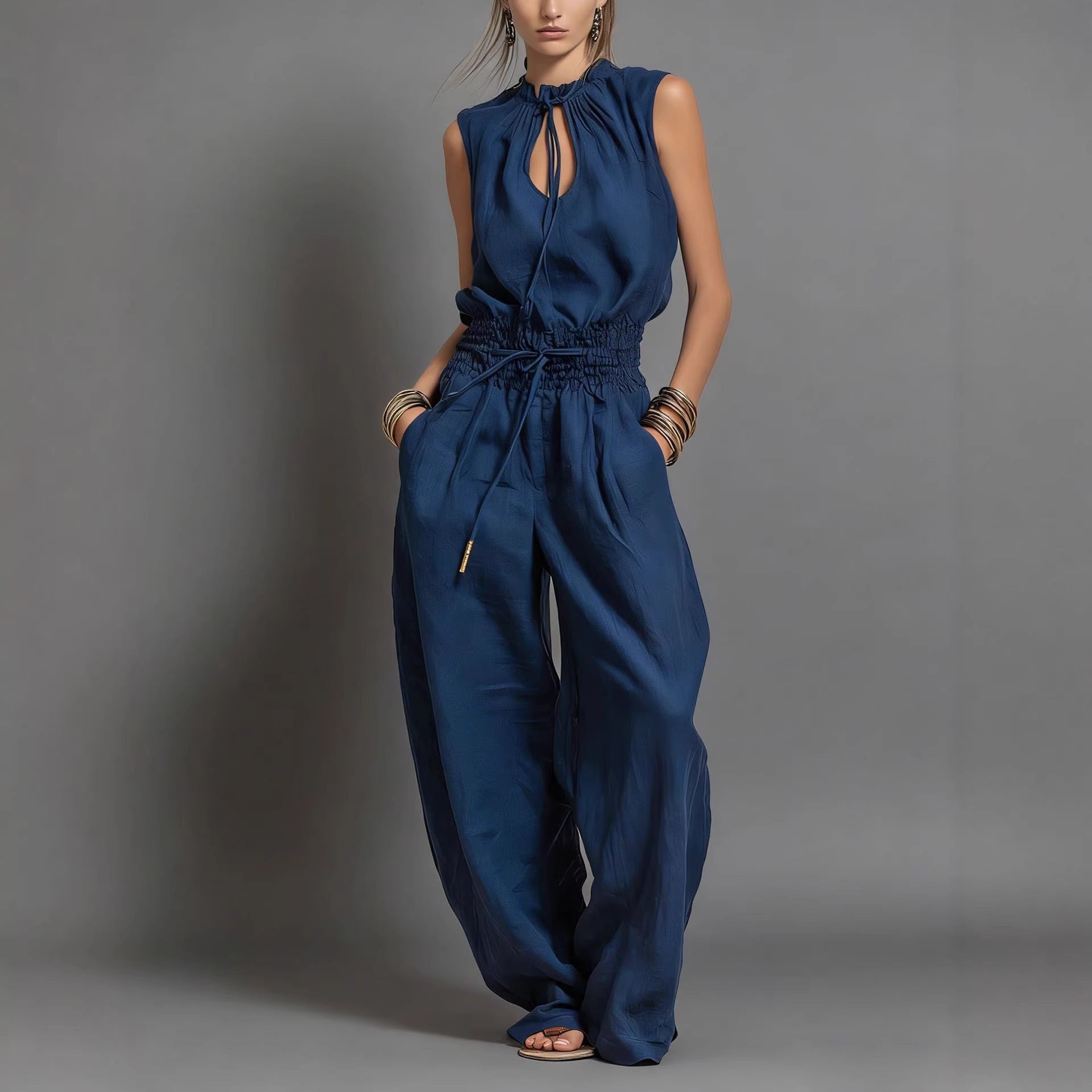 Women's sleeveless high-waist wide-leg pleated jumpsuit from FitiqueFit, casualwear with a relaxed fit and stylish design.