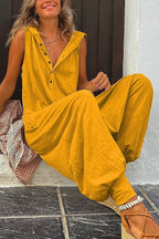 Women’s sleeveless hooded relaxed fit jumpsuit by FitiqueFit, casualwear style with a comfortable, flowing fabric and hood detail.