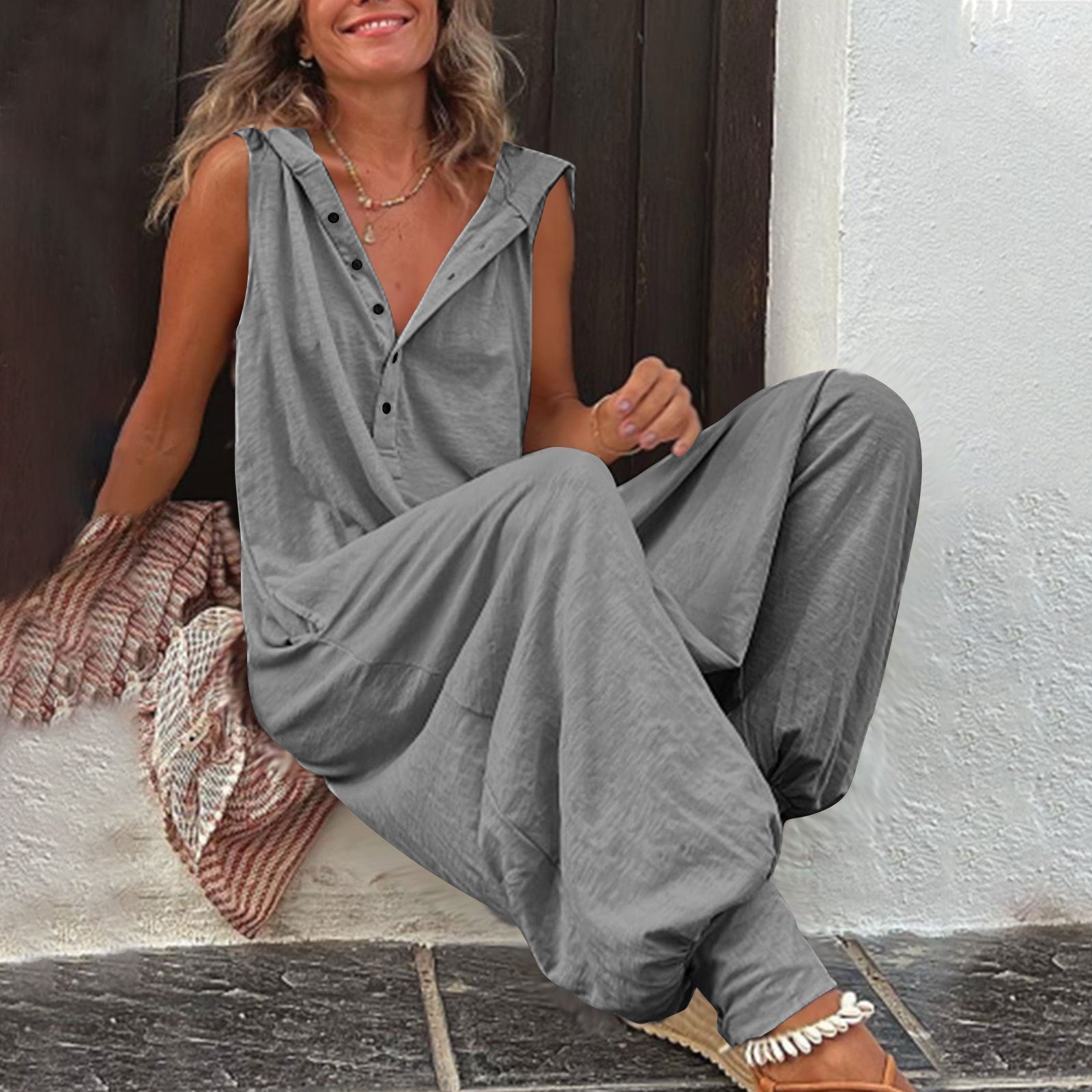 Women’s sleeveless hooded relaxed fit jumpsuit by FitiqueFit, shown on a model, featuring a casual, comfortable design.