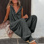 Women’s sleeveless hooded relaxed fit jumpsuit by FitiqueFit, featuring a casual, comfortable design with a drawstring waist and pockets.