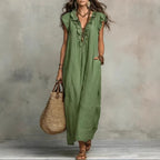 Women's sleeveless ruffle pocket maxi dress by Plush Fashion Hub, flowing casualwear with ruffle details and side pockets.